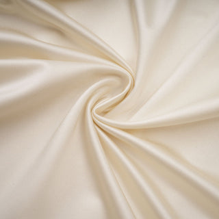 Close-up of beige fabric with folds