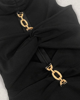 Black knit midi dress with gold chain details and cutout design, halter neckline, and scoop back.