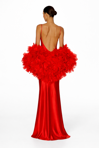 Red evening gown with floral details on a white background