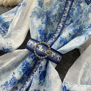 Blue and white floral patterned fabric with a decorative belt