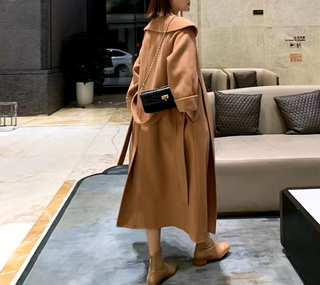 Stylish camel cashmere wool coat with a belted waist and large lapel, showcasing its elegant double-sided design. Camel Max Mara Style Belted 