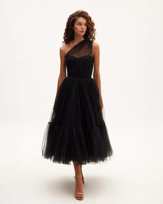 Elegant black cocktail dress with asymmetric neckline and flowing tulle skirt.