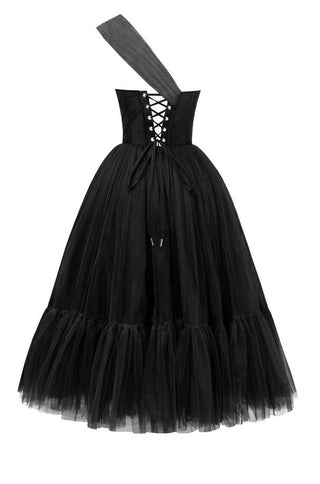 Elegant black cocktail dress with asymmetric neckline and flowing tulle skirt.