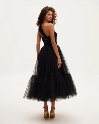 Elegant black cocktail dress with asymmetric neckline and flowing tulle skirt.