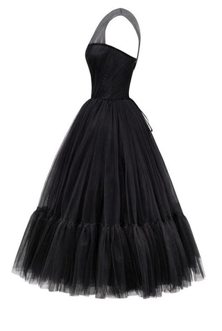 Elegant black cocktail dress with asymmetric neckline and flowing tulle skirt.