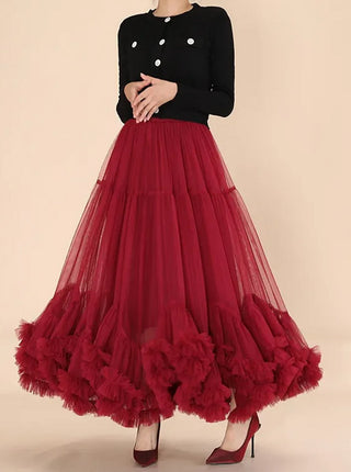 Red tulle midi skirt with romantic ruffled hem and elastic waistband.