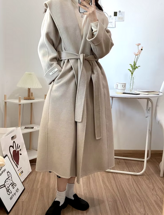 Elegant white cashmere wool coat with a belted waist and large lapel, showcasing its double-sided design. Max MaraCoat similar dupe