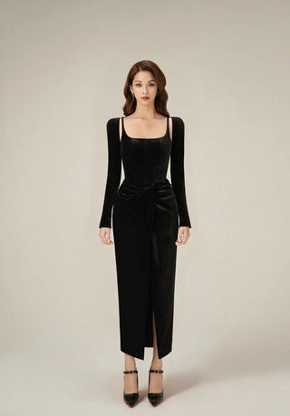 Front slit detail of a black velvet evening dress, combining elegance with a bold modern touch.