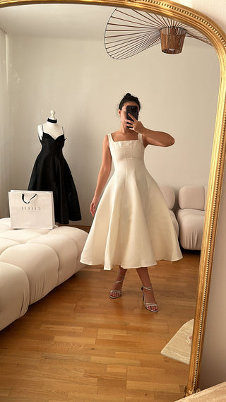 Minimalistic flared white midi A line Flared dress with square neckline available in various colors, perfect for elegant events or cocktail dress rental in Vienna. Bridal dress elegant minimal 