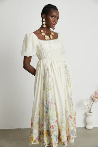 Woman wearing Maxi Floral Dress Puff Arms short linen white 