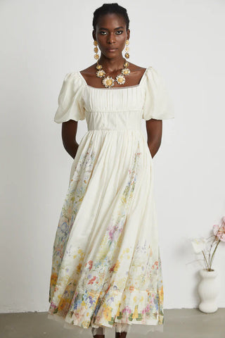 Woman wearing Maxi Floral Dress Puff Arms short linen white 