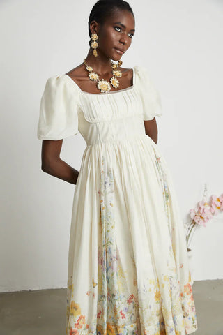 Woman wearing Maxi Floral Dress Puff Arms short linen white 