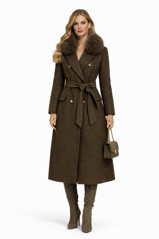 Woman wearing a brown coat with fur collar on a white background