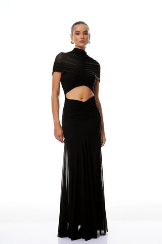 Woman wearing a black dress with a cutout design on a white background