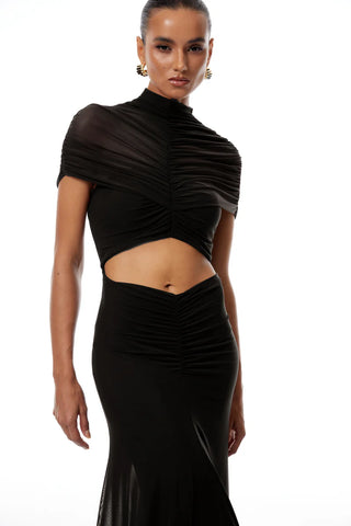 Black ruched top and skirt set on a model against a white background