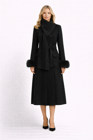 Woman wearing a black coat with fur trim on a white background