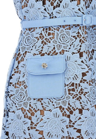 Model wearing Isola baby blue guipure lace mini dress with floral appliqué and belted waist