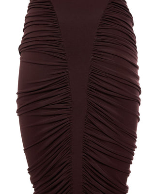 Close-up of a brown pleated dress on a white background