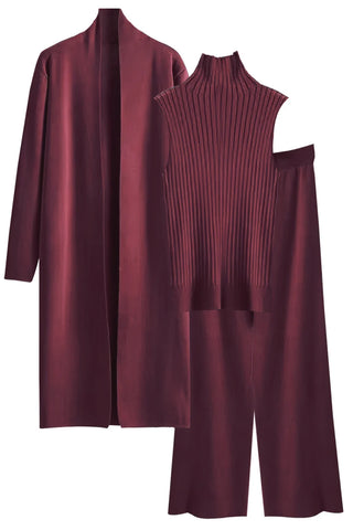 Maroon outfit with a coat, sweater, and pants on a white background