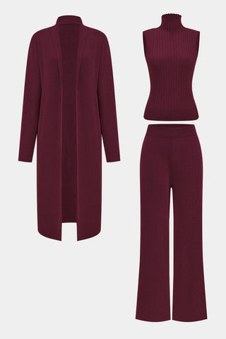 Burgundy cardigan, top, and pants set on a white background
