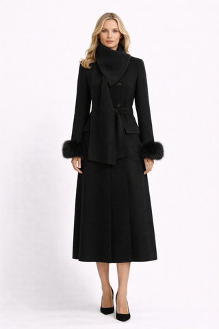 Woman wearing a black coat with fur trim on a white background