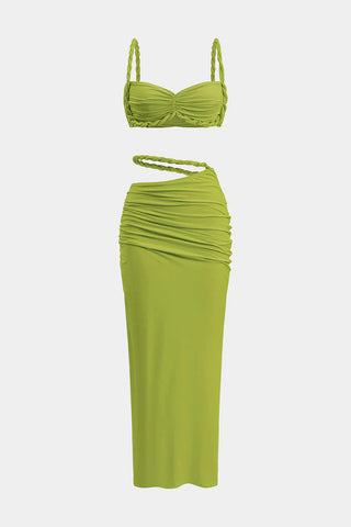 Green bikini set with a strapless top and ruched skirt on a white background