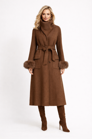 Woman wearing a brown coat with fur trim on a white background
