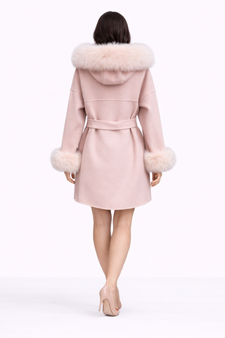 Pink coat with fur hood and cuffs on a white background