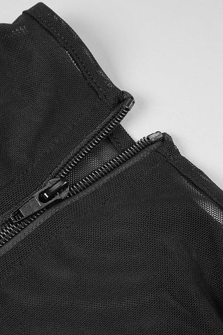 Close-up of a black zipper on a textured surface