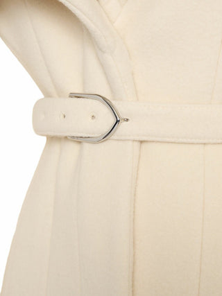Close-up of a beige trench coat with a belt and buckle on a white background