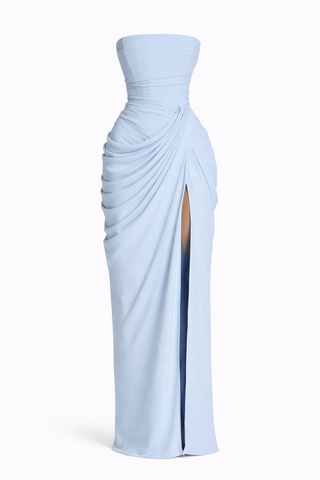 Light blue strapless gown with a slit on a white background
