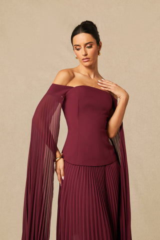 Model wearing burgundy off-shoulder two-piece formal set with pleated chiffon cape sleeves and maxi skirt Burgundy Winter Winered Chiffon Pleated Skirt 