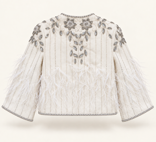 An off-white cropped jacket featuring vertical tufted stitching, silver beaded floral and leaf patterns on the yoke, and long feathered sleeves with matching beaded trim.