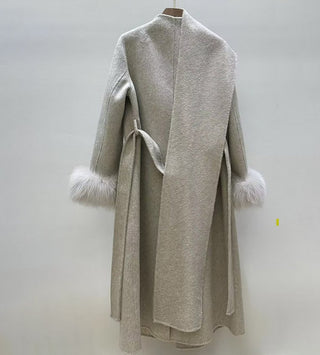 Gray coat with fur trim on a white background