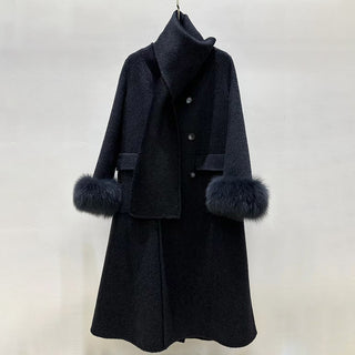 Black coat with fur cuffs on a white background