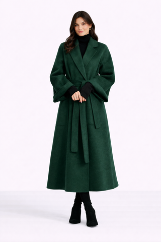 Woman wearing a green coat on a white background