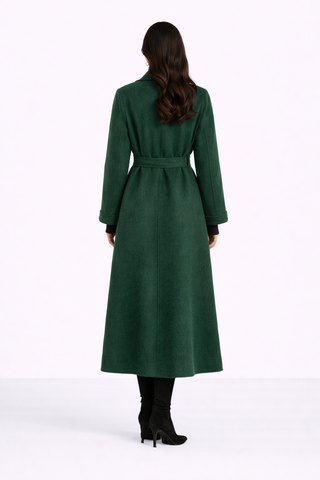 Woman wearing a green coat on a white background
