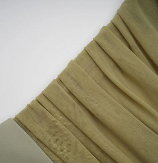 Stack of green fabric on a white background