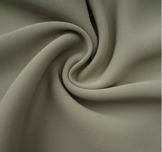 Close-up of beige fabric with folds
