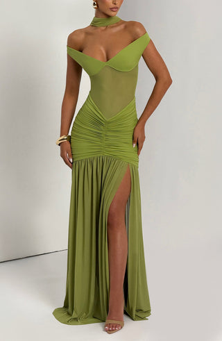 Green evening gown with a high slit on a white background
