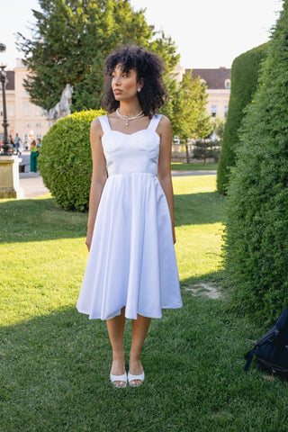 Elegant Alaia bridal dress with a vintage modern chic design, featuring a flattering V-neckline, sleeveless cut, adjustable back straps, and a full skirt with a subtle flare. Perfect minimalistic wedding gown for the contemporary bride seeking timeless elegance.Modern clean minimal dress white A line Spaghetti Straps, Corset Bustier - Cielie 