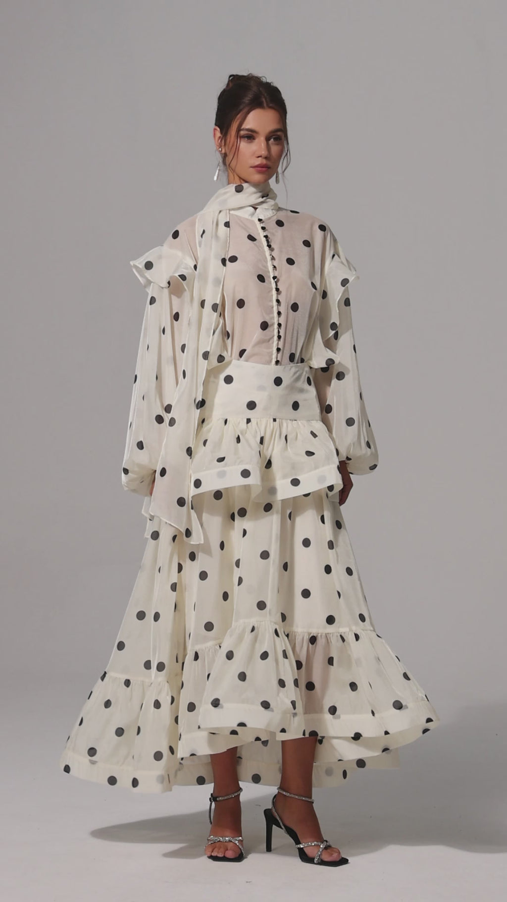 Model wearing full Julia Polkadot Set with blouse, maxi skirt, and matching scarf in ivory with black polka dots, front view