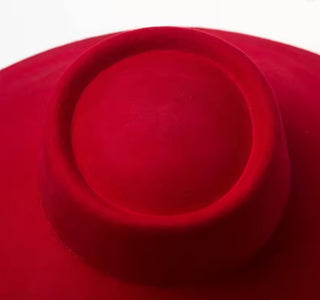 Close-up of a red hat with a white background