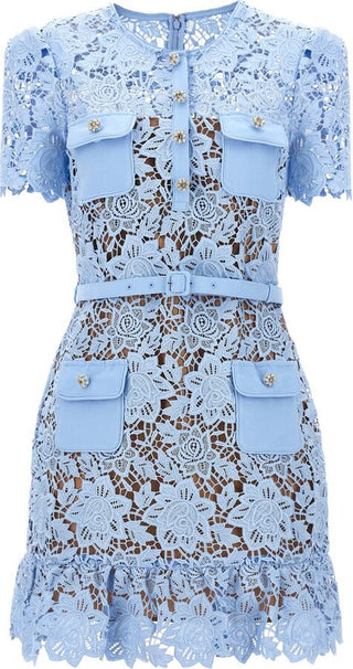 Model wearing Isola baby blue guipure lace mini dress with floral appliqué and belted waist