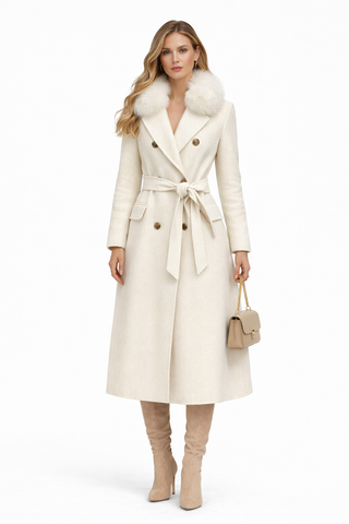 Woman wearing a cream trench coat with fur collar on a white background